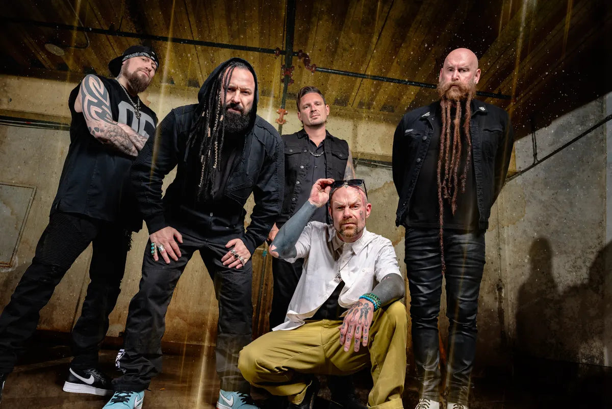 Five Finger Death Punch photographed together in an industrial basement